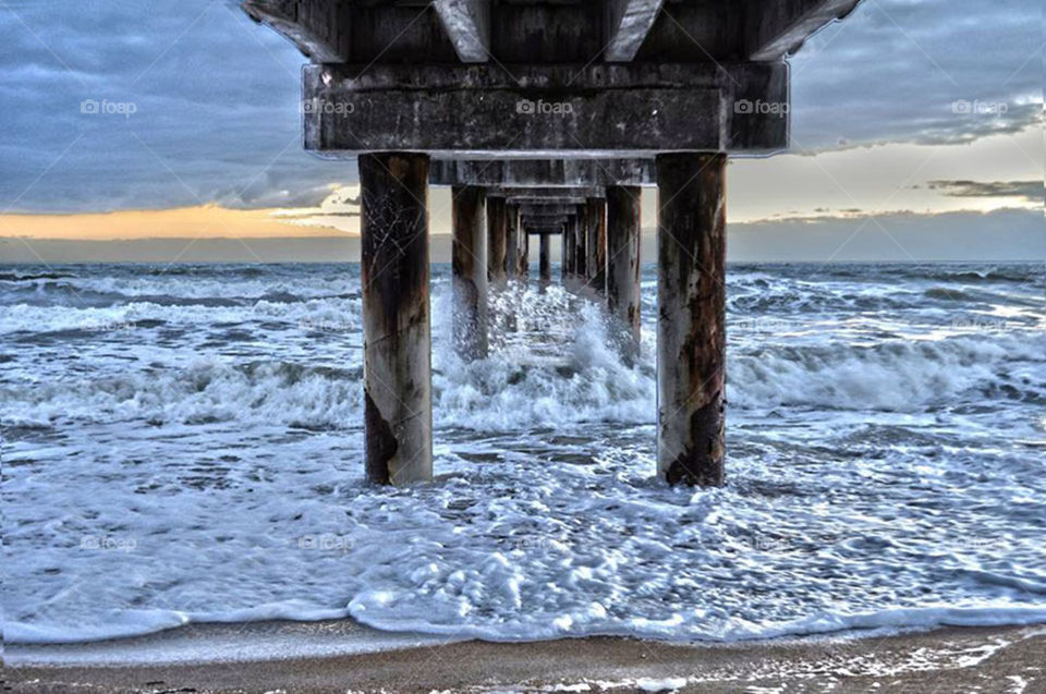 Pier. waves crashing under pier in Myrtle Beach,  NC