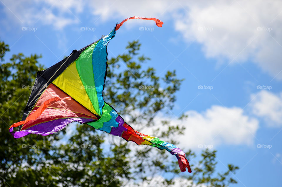 Rainbow kite flying in the sky