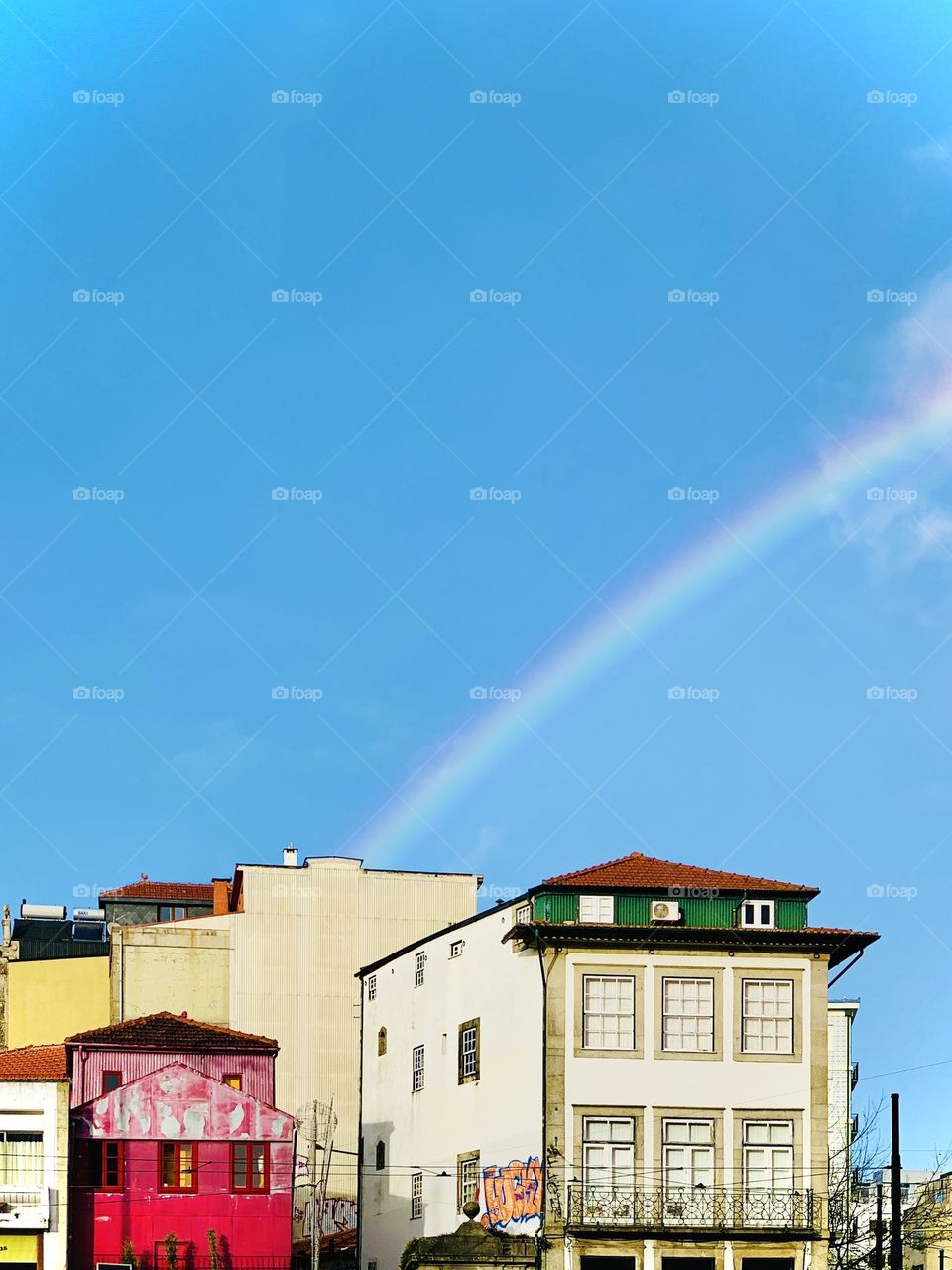 Rainbow over houses