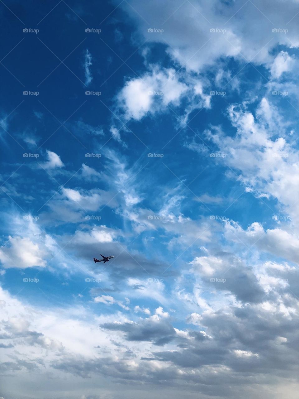 Flying airplane cross the foggy sky 