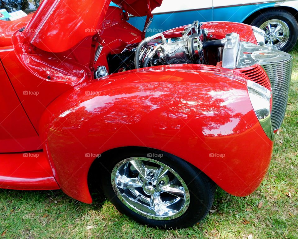 Shiny older model vehicle! The Red Story! Red is color of passion. It's the color that is always seen on heart decorations on Valentine's Day! Red is astonishing, exhilarating, and fills your world through feelings and emotions!
