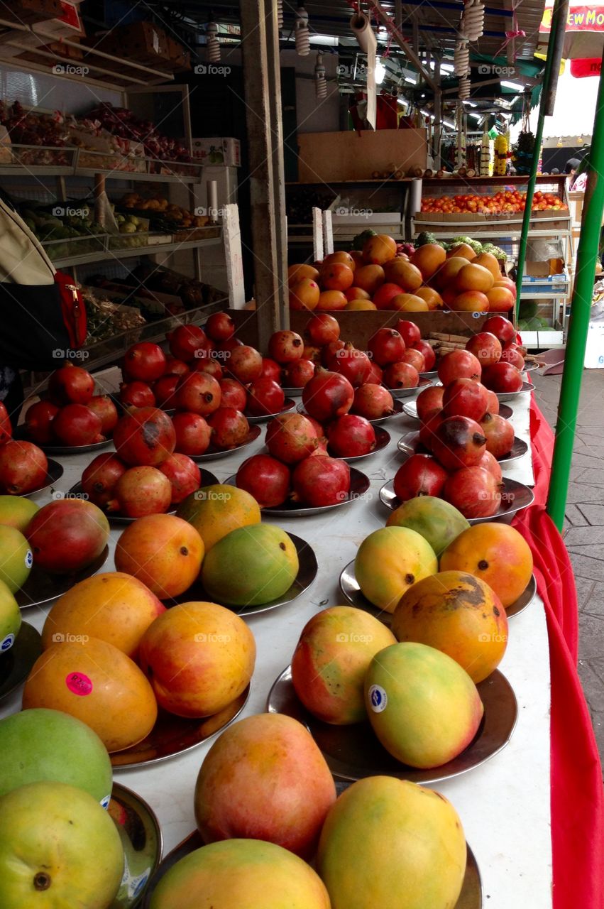 Tropical fruits, mango, pome grenade, on display in Little India, Singapore.