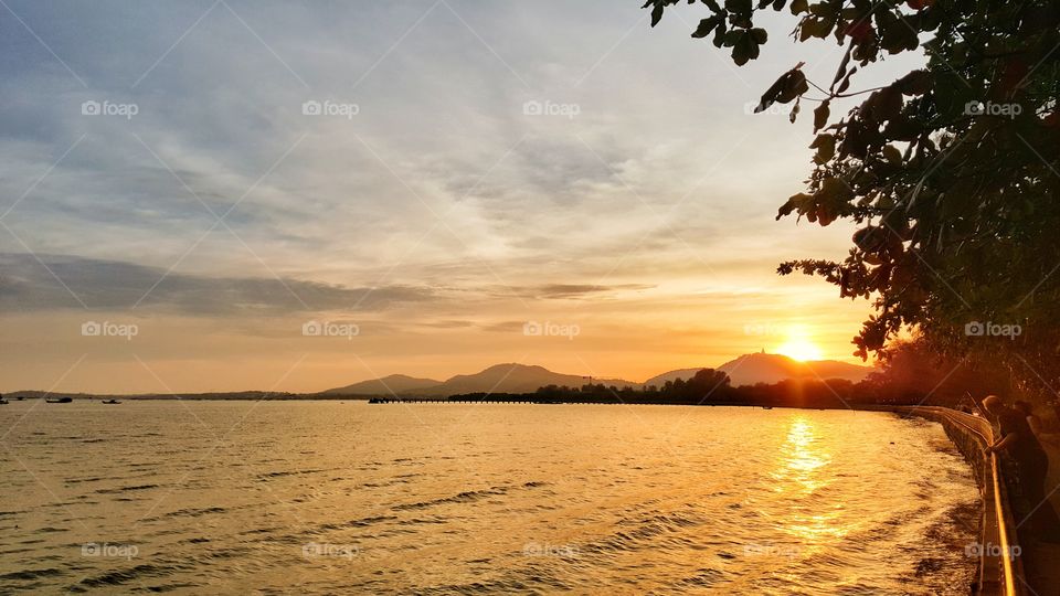 beautiful sun set sky mountain and sea background