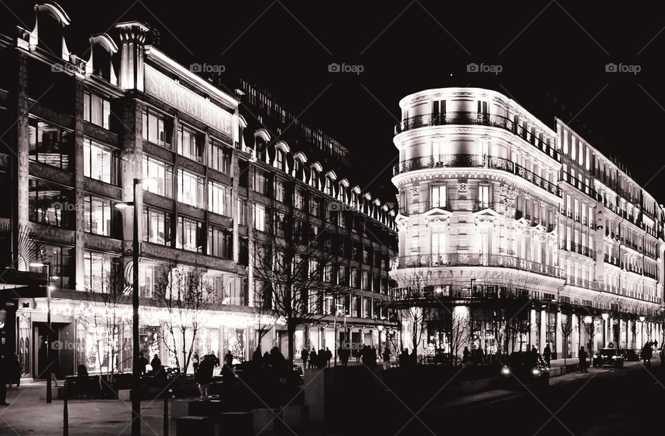 Illuminated Samaritaine Art Nouveau and Art Deco department stores at night time in Paris