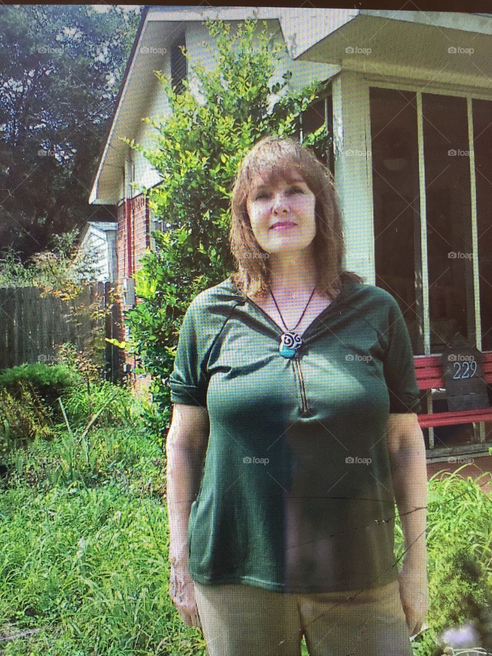 Smiling woman standing in park