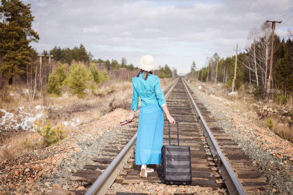 girl goes on railway