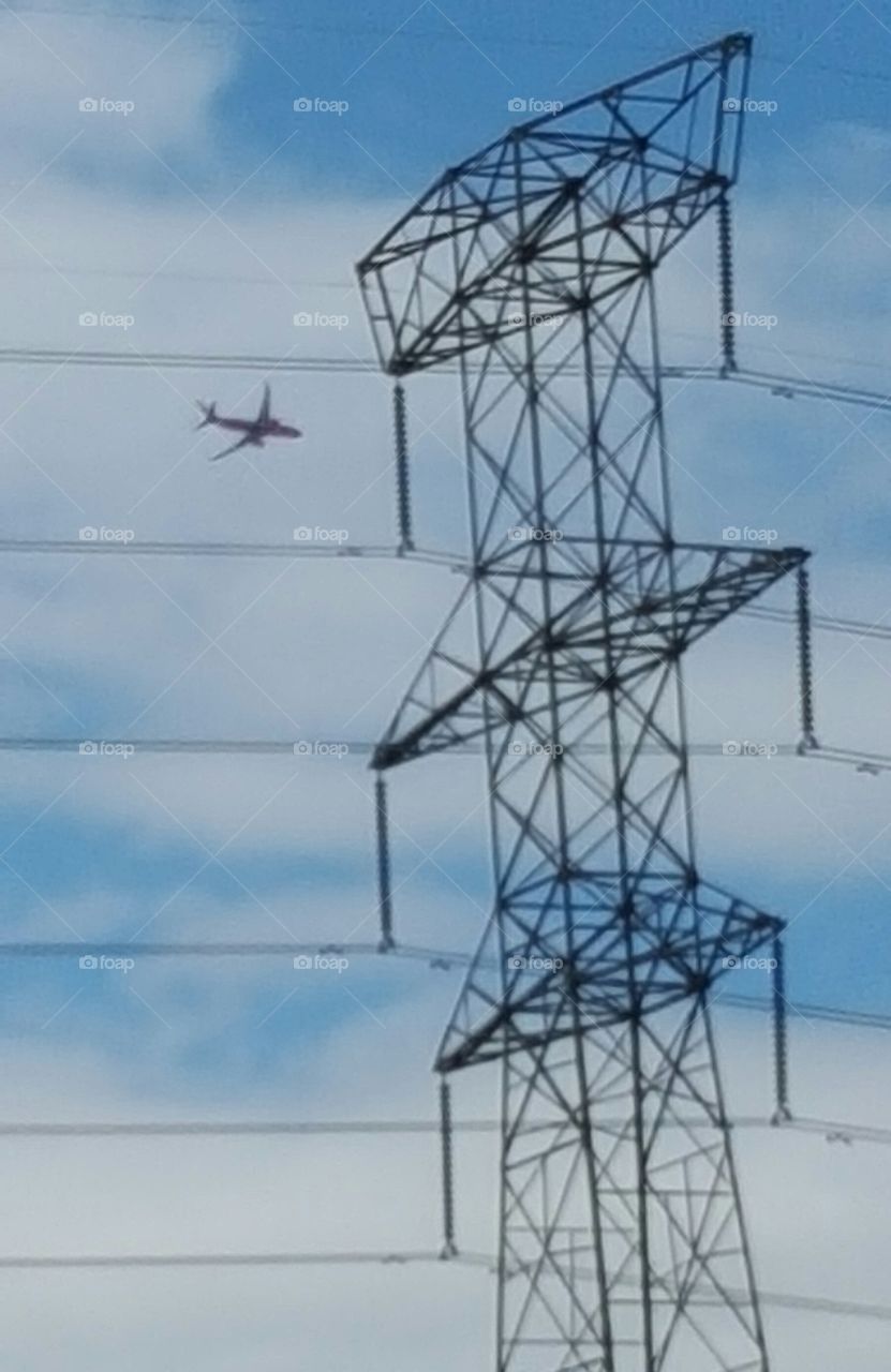 Plane flying near power lines