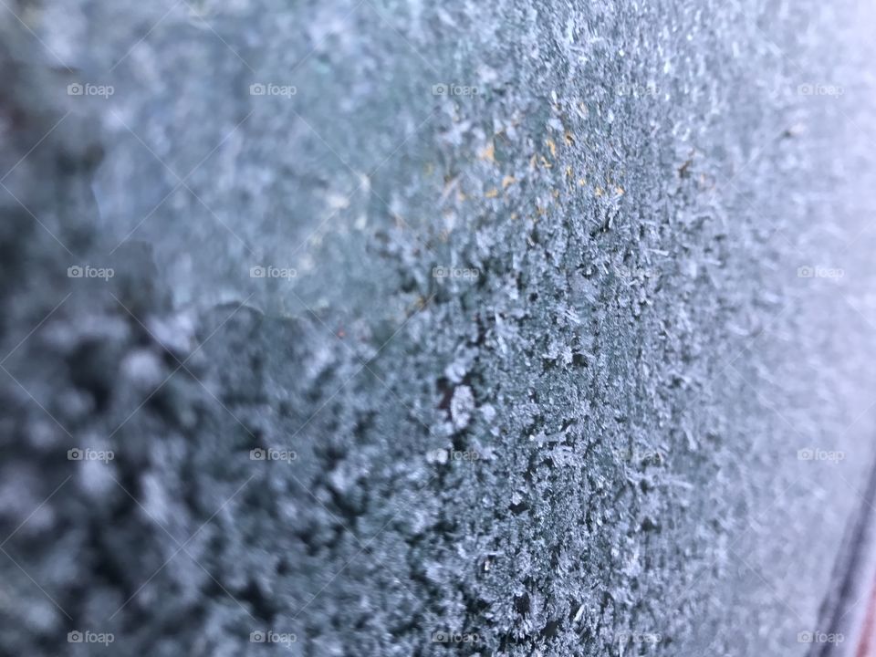 Frost on car window winter