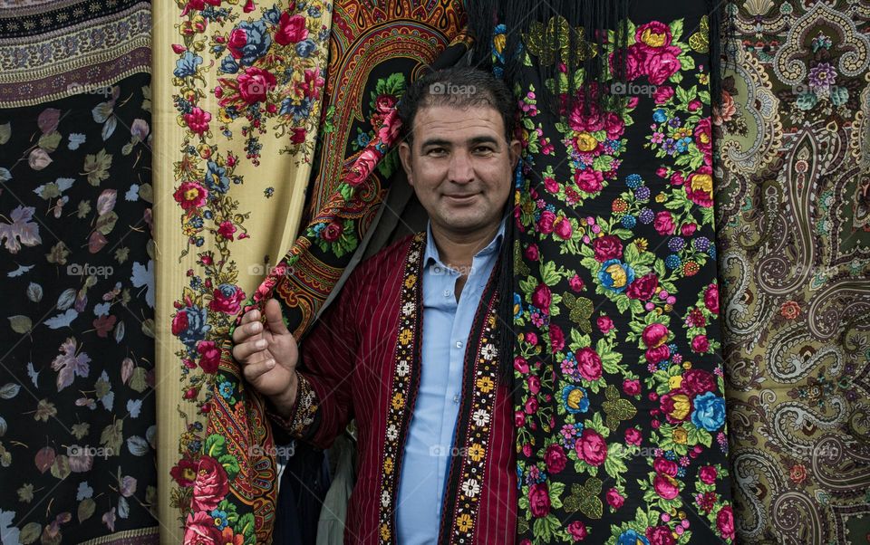 Turkmen man among traditional headscarves