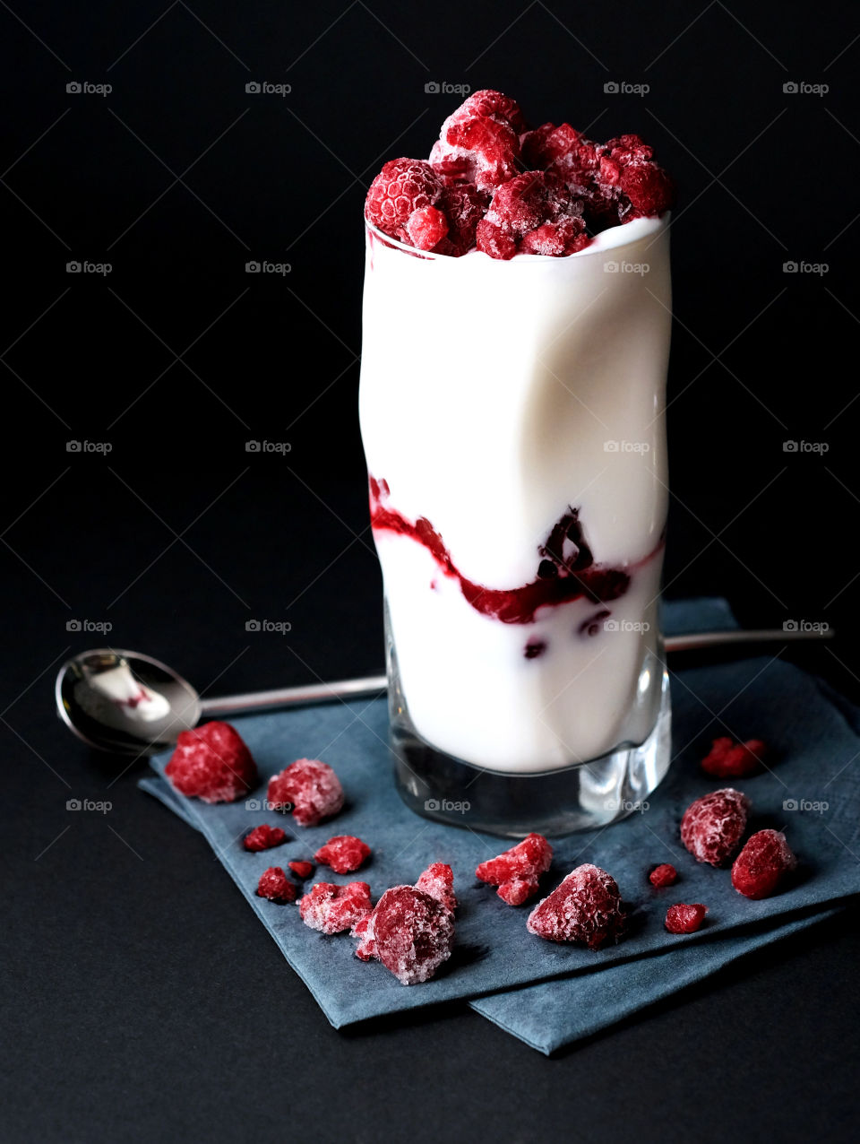Raspberry ice cream against black backgroung