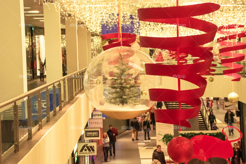 Christmas Shopping In Mall Center With Christmas Tree Festive Decoration
