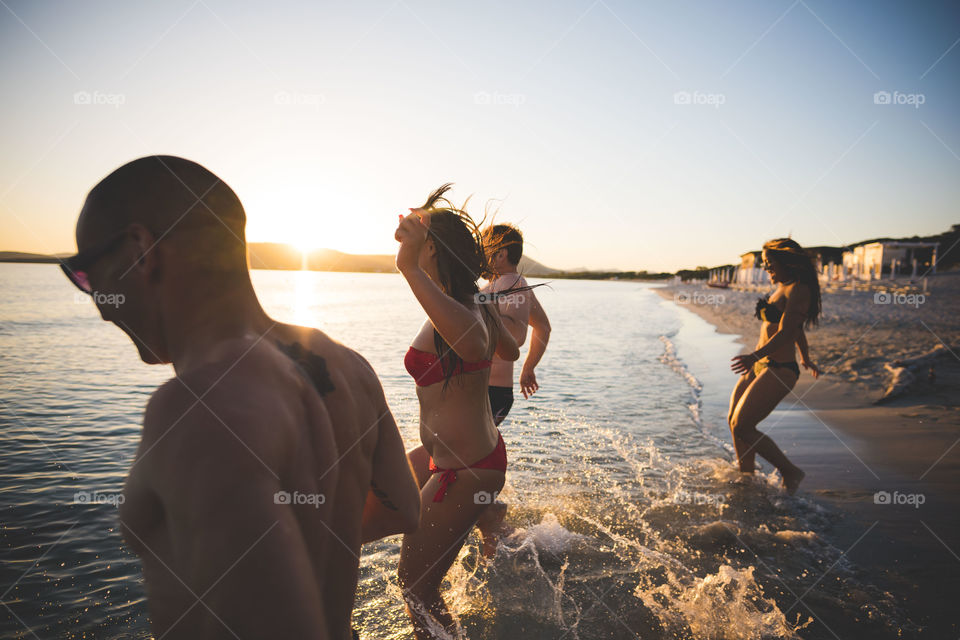 group of friends in summertime Beach in Sardinia