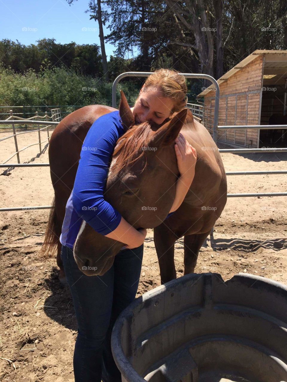 My friend, Kate with her buddy Nate at the stables she works as a stable hand.