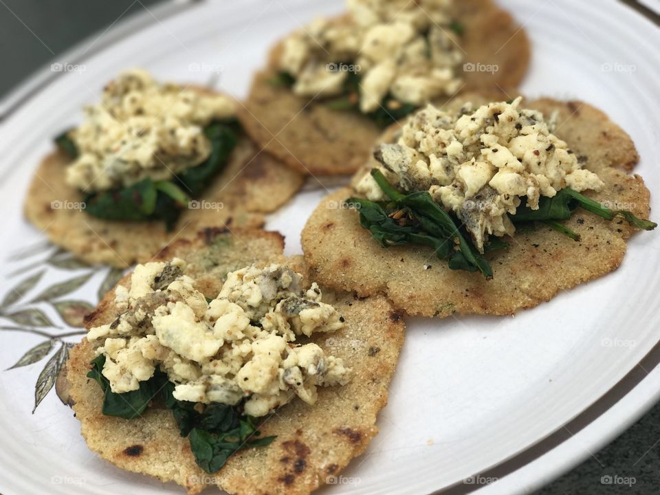 I call these spinach and egg white tostada! Perfect healthy breakfast the shell I made with cream of rice! 
