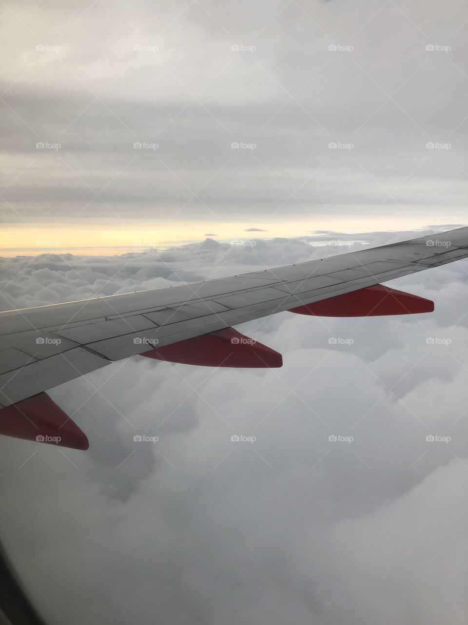 Flying in the clouds at sunset 