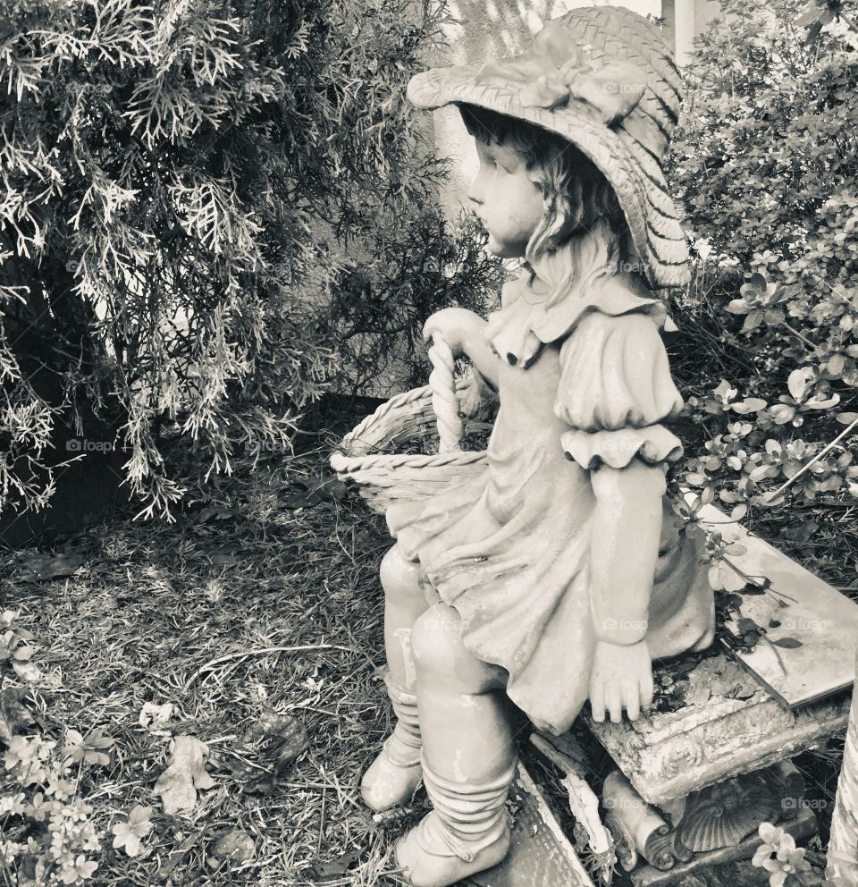 Garden statue of little girl