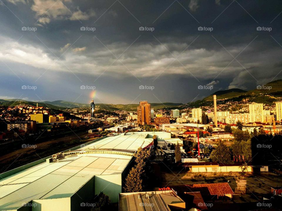 Cloudy sky with the rainbow