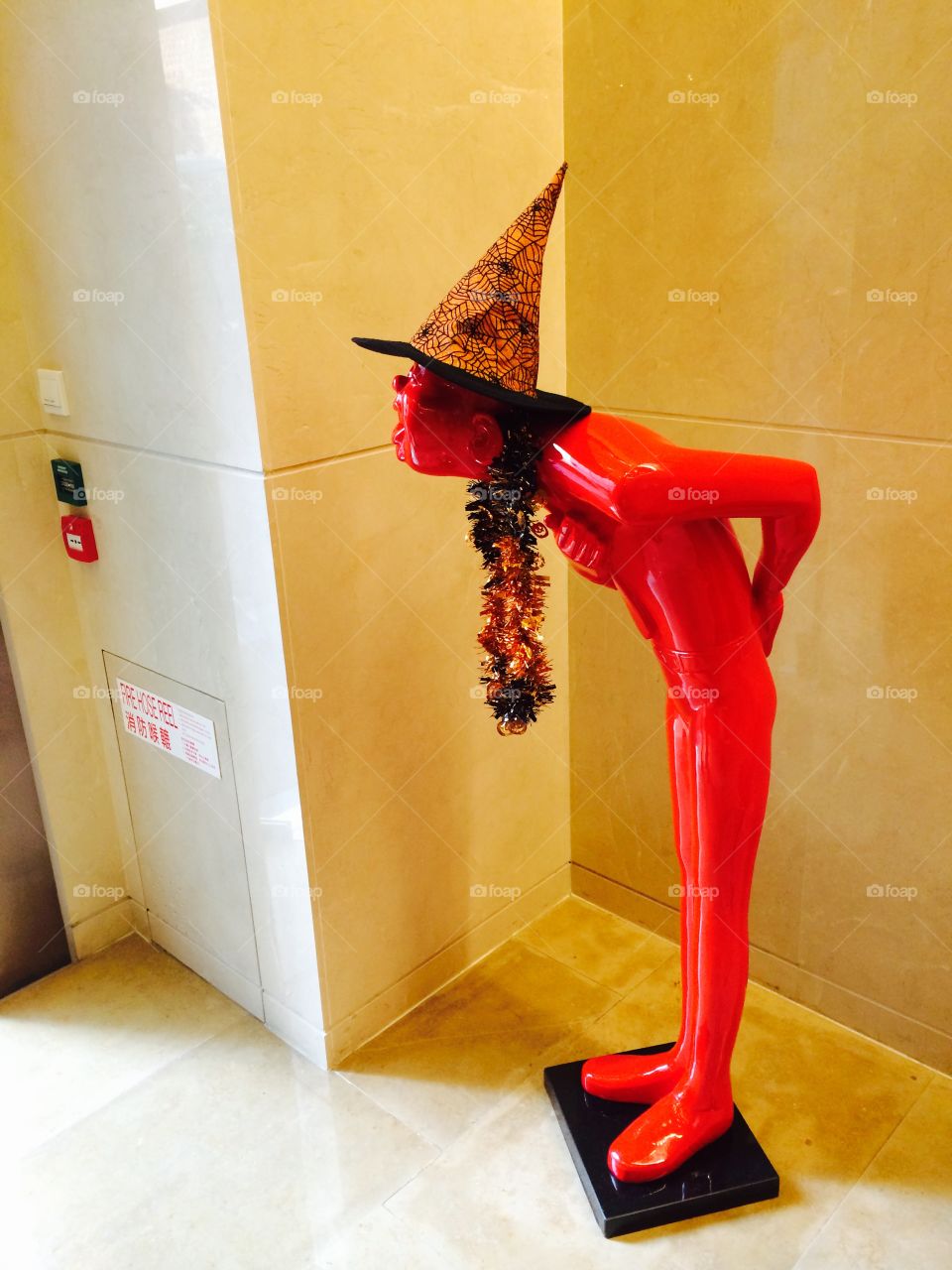 Funny sculpture Halloween . Halloween hat on funny sculpture 