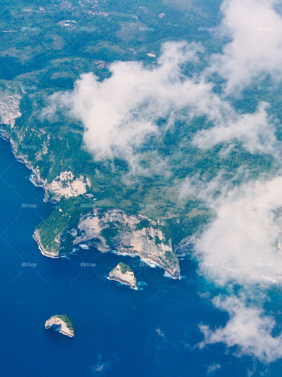 Beautiful Indonesia cliff and coast view from airplane 