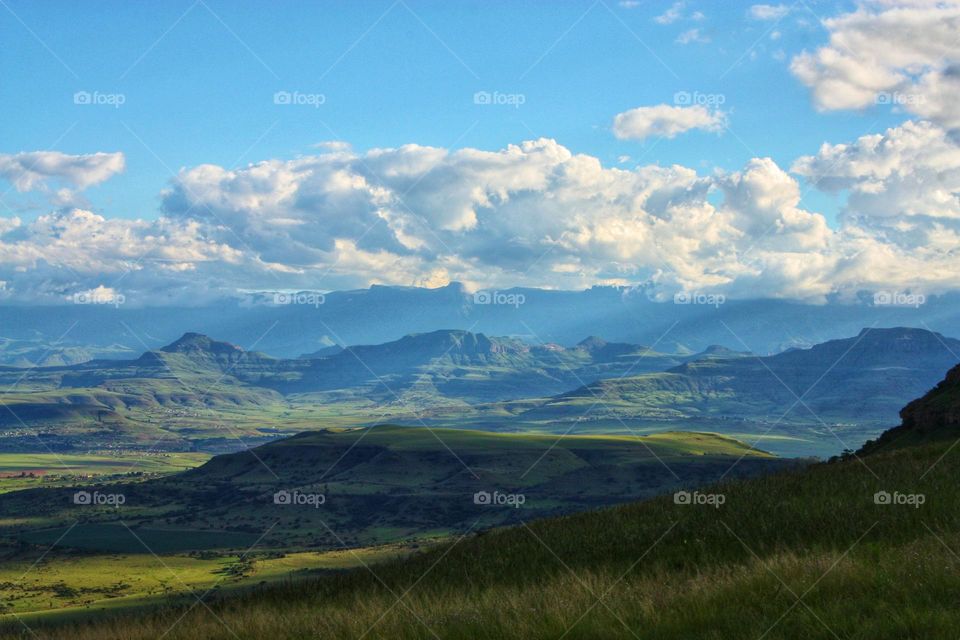 clouds rolling in over the mountains.