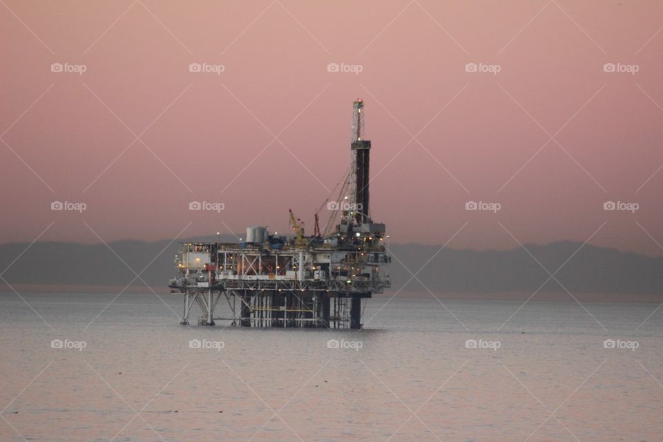 Oil rig at sunrise