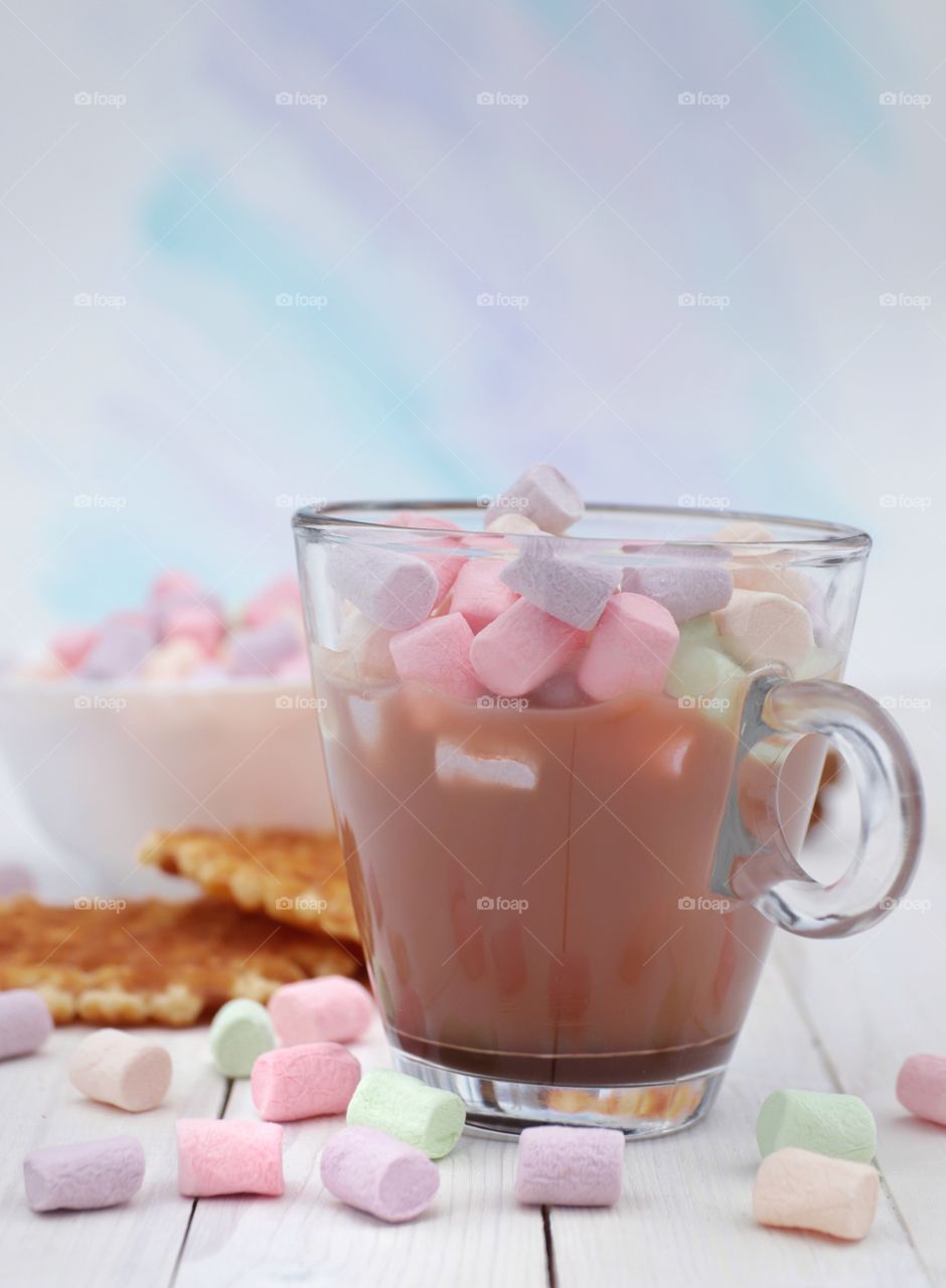 Sweet multicolored marshmallows in a cup of hot chocolate