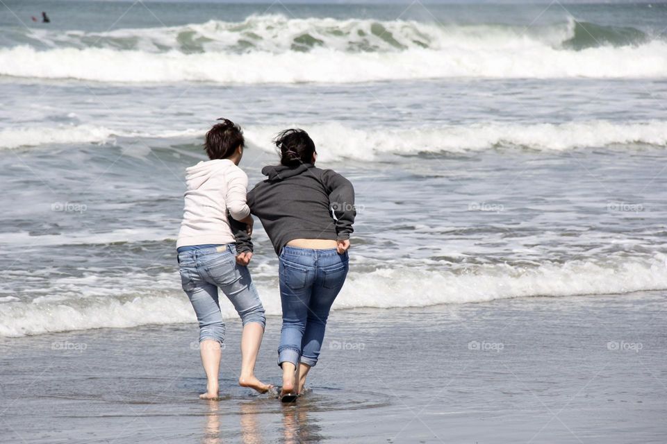 Playing girls at the beach 