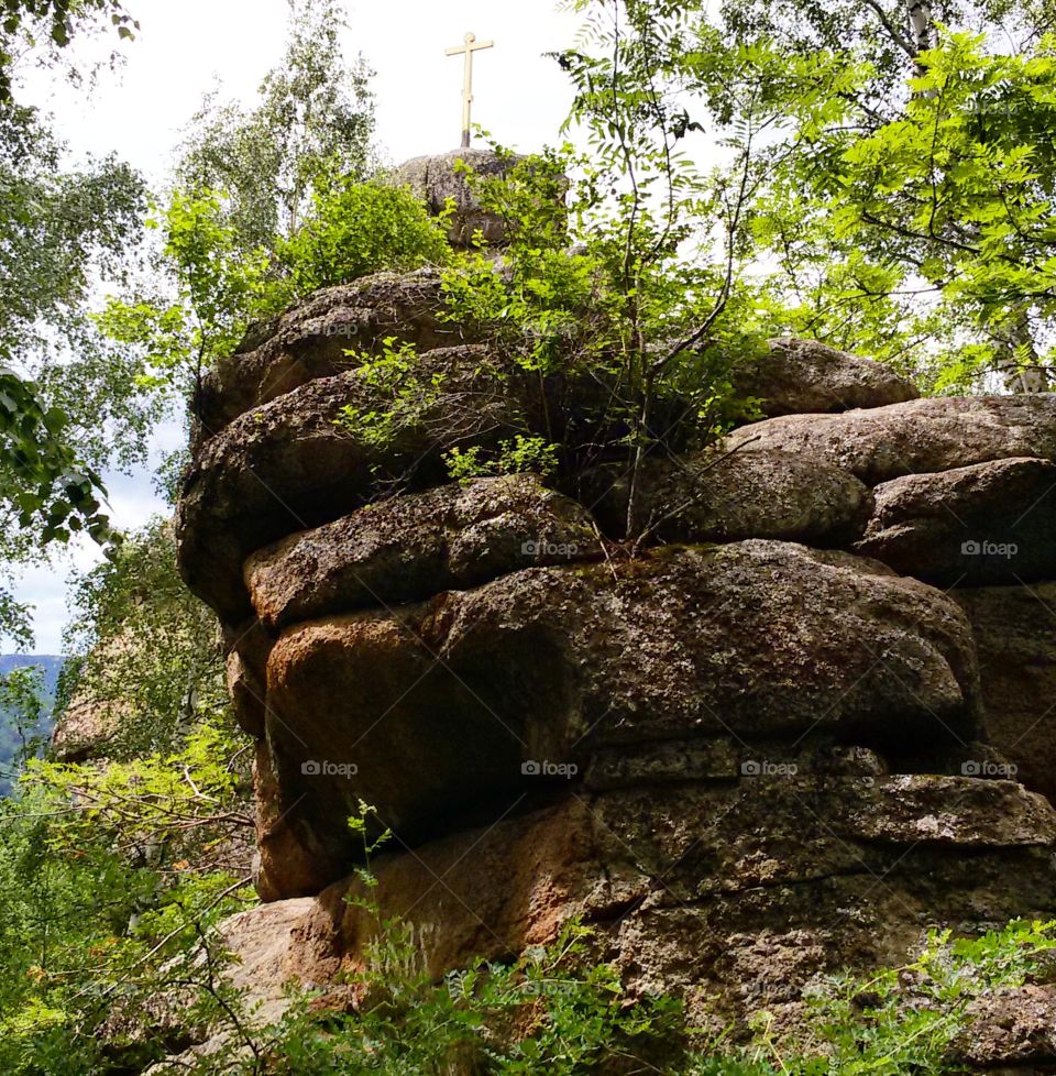 Orthodox cross on a rock