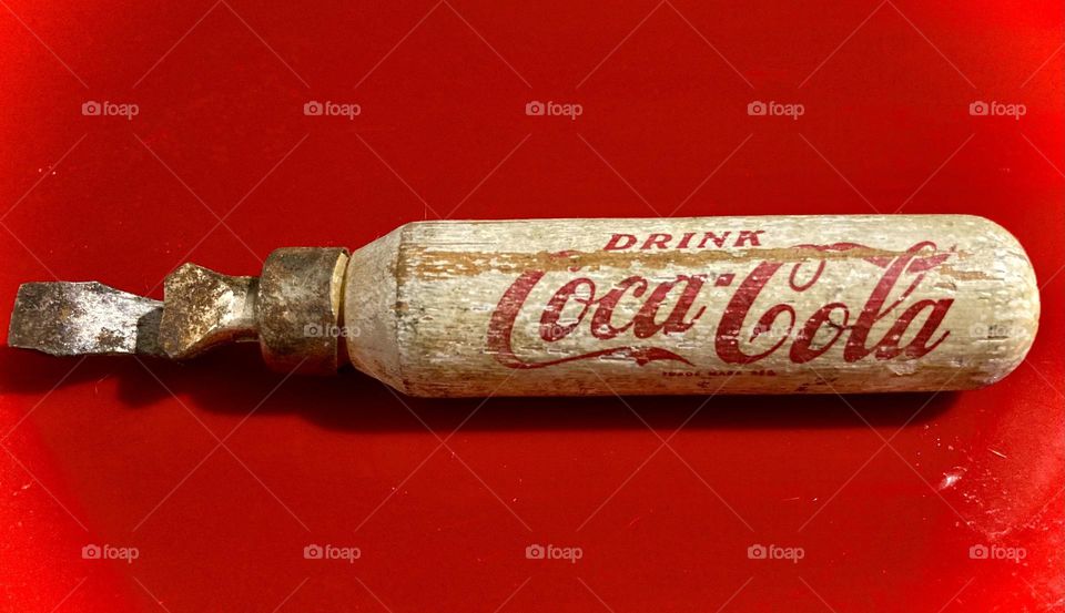 Antique Coca-Cola bottle opener.