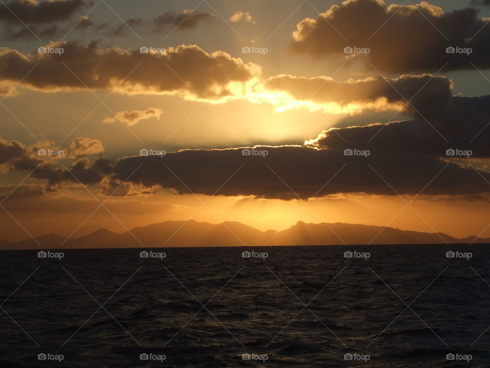 sunset at the Atlantic Ocean with island