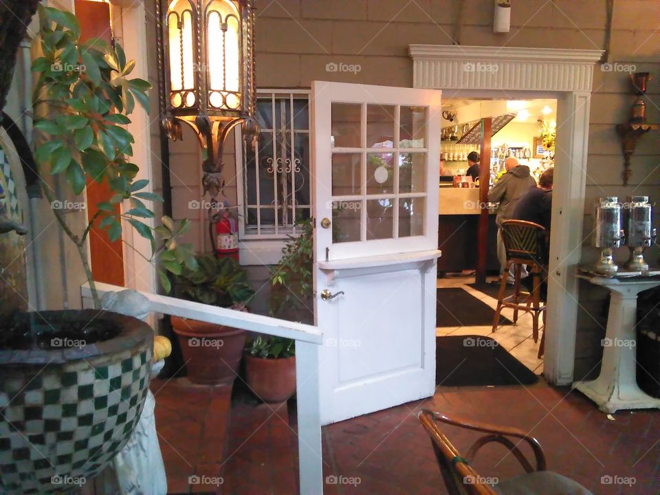 a shot of an entry to an interesting cafe/bakery, near LA; from the outdoor, protected patio seating area