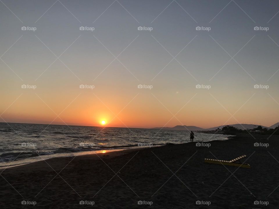 Golden time with a golden sunset in the background on the beach of Ada Bojana in Montenegro.