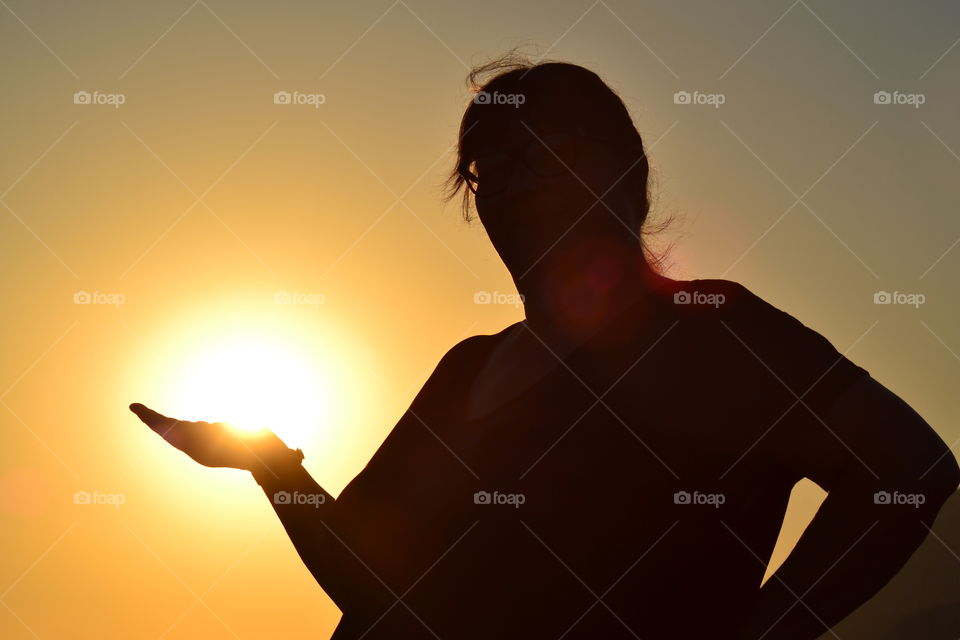 sunsetting in womans hand