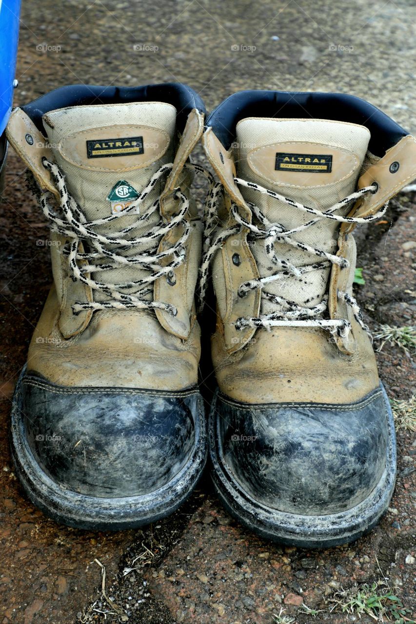 Pair of old boots discarded on the street