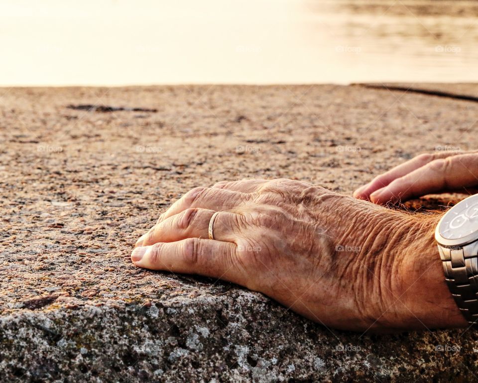 Hands on stone background