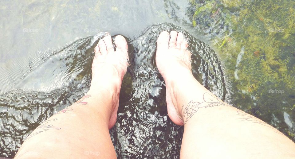 soaking my feet in the river