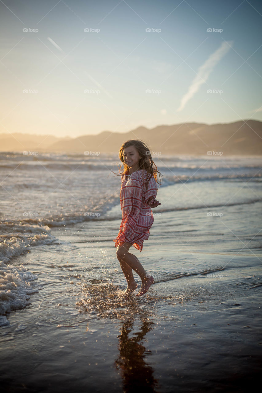 Sunset bliss. Abella playing on the beach at sunset 