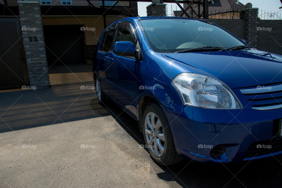 Toyota raum. blue car new a house