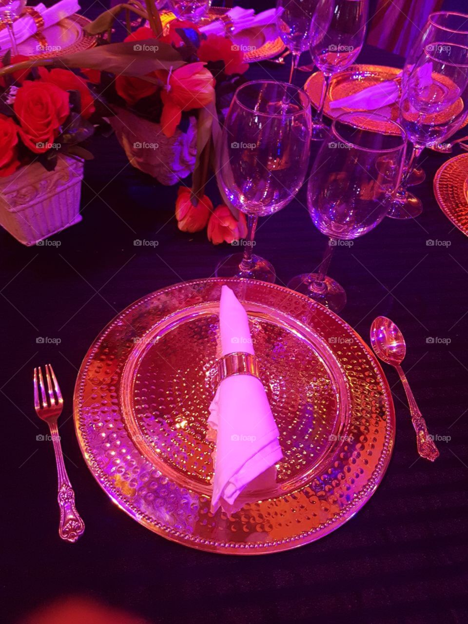 royal golden plate spoon and glass arrangements on dining table