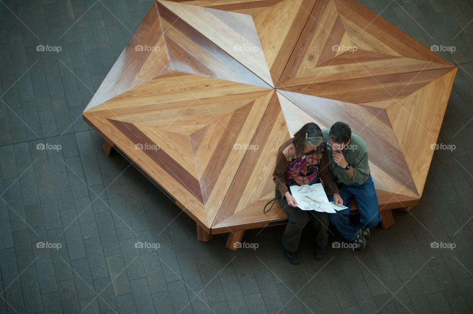 Couple looks at a map in a museum