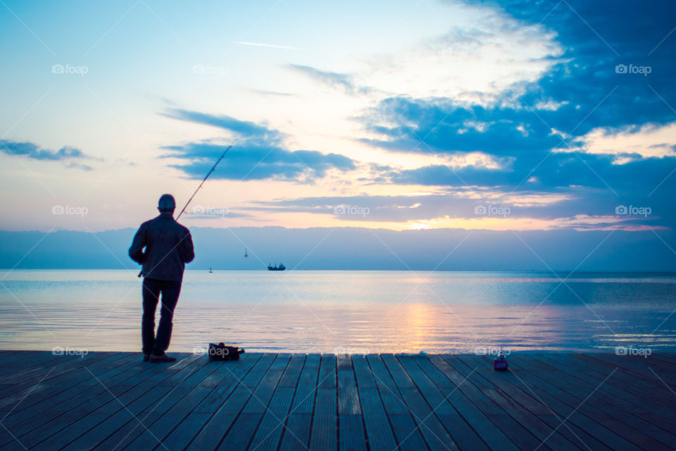 Fisherman In The Sunset
