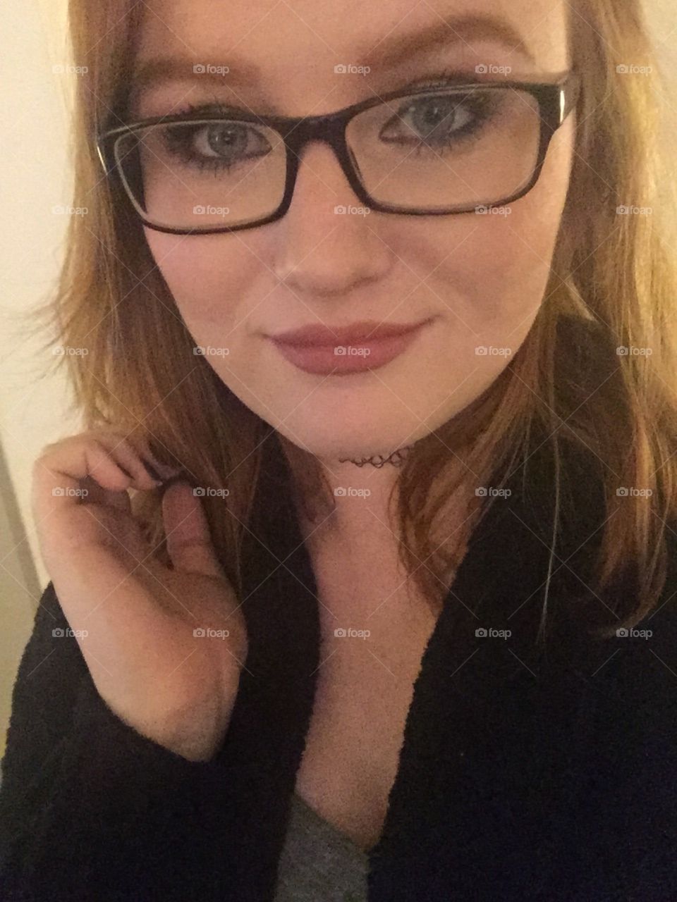 Happy redhead girl with glasses 