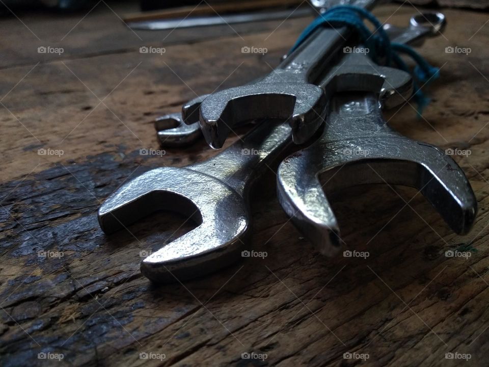 Spanners set on the old wooden table. Ready for repair