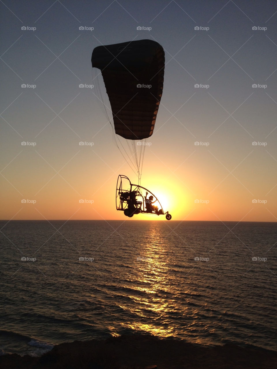 sunset silhouette israel parachute by sahar