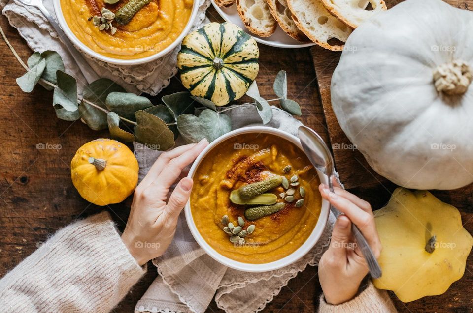 Fall foods. Delicious Pumpkin soup and fresh bread.