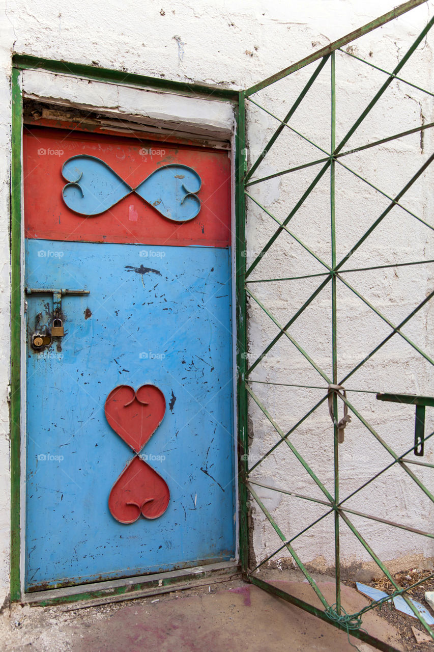 An old blue and red door