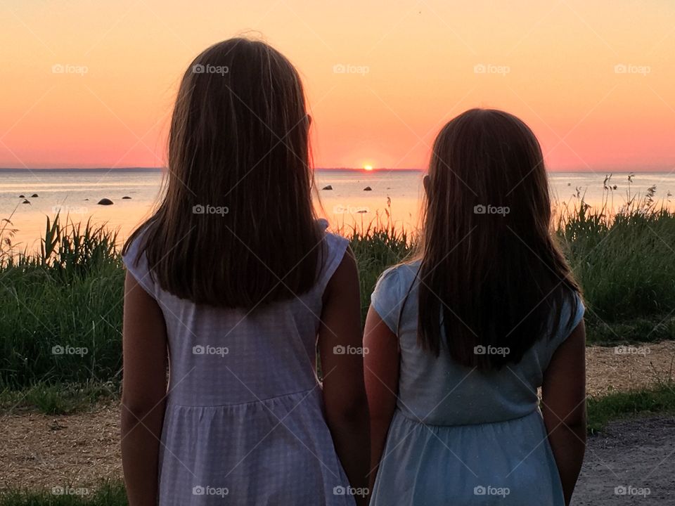 Sisters watching sunset. 