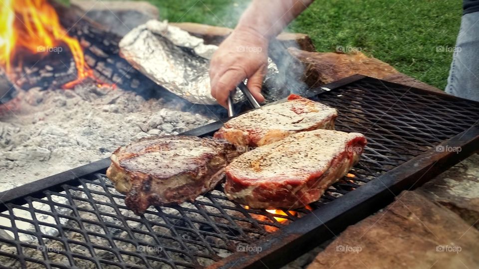 Steaks on an open fire