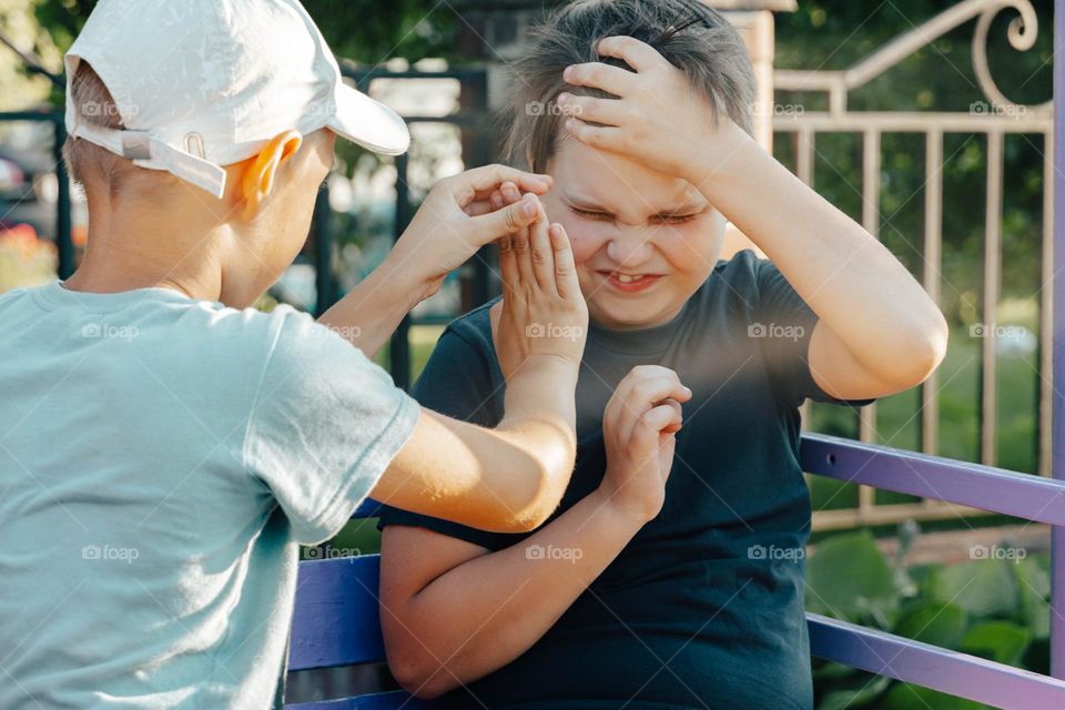 Two kids friends playing feeling disgusting 