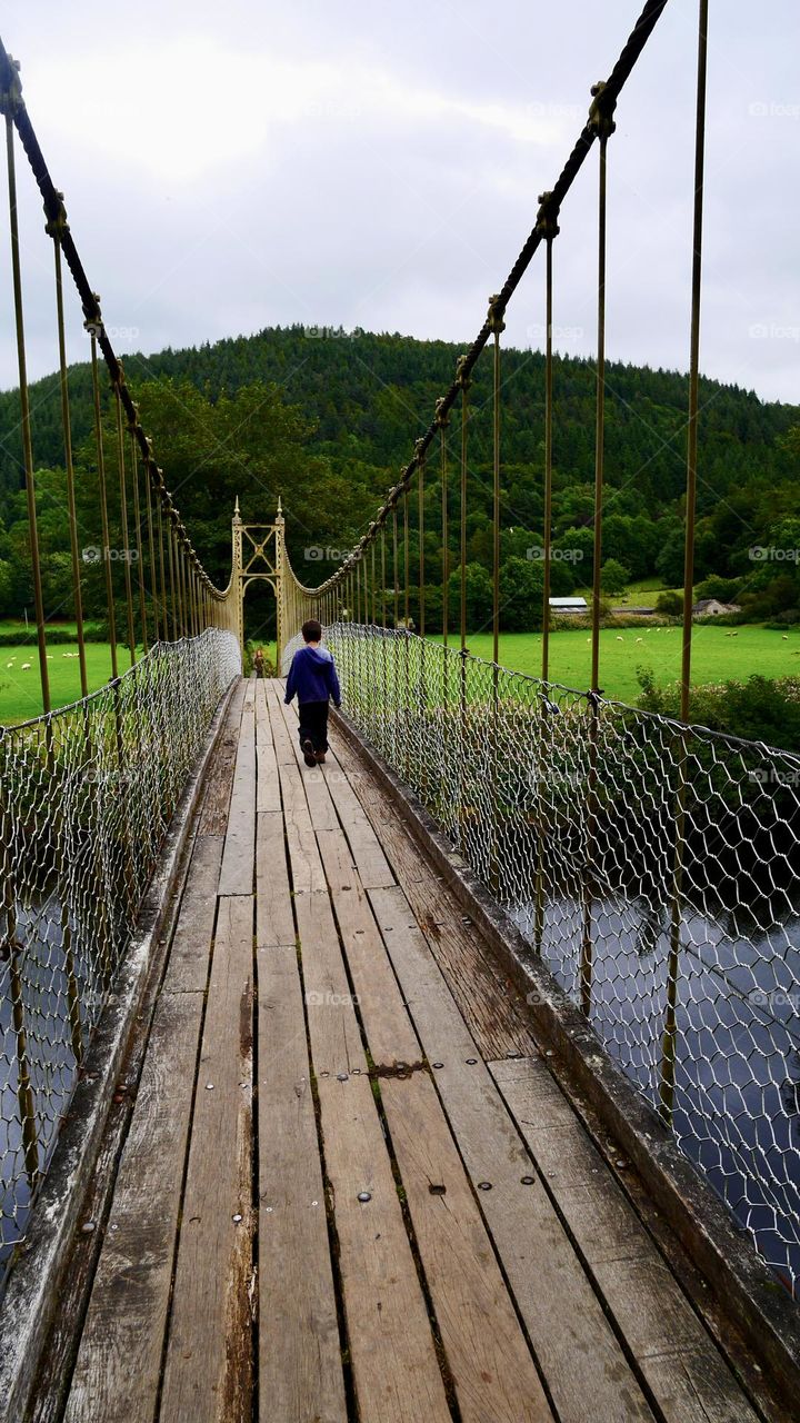 Walking on hanging bridge Wales Uk